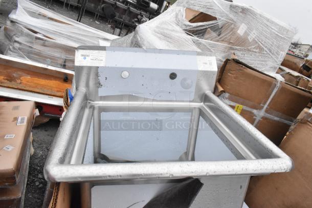 Stainless steel sink from scratch and dent lot, new condition. Features rounded edges, visible labels, packaging dents.