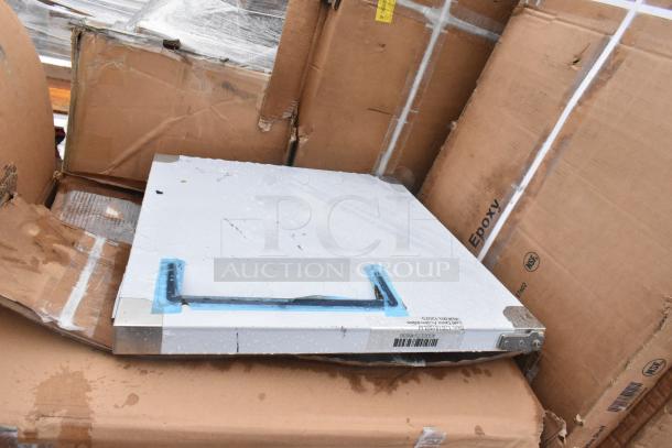 New scratch and dent item on pallets, including a sink with visible packaging. Label: "Epoxy" and barcode present.