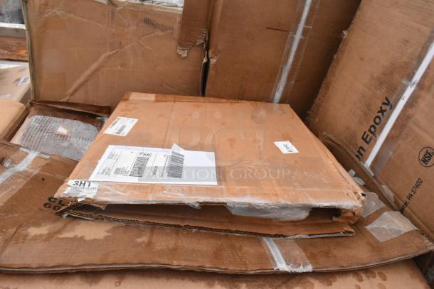 Boxes labeled for 10 scratch and dent items, including a sink and work table. Visible shipping labels indicate package details.