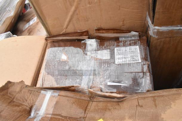 Damaged cardboard box containing 10 brand new scratch and dent items, including a sink and work table, sealed with tape.