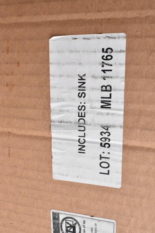 Label on cardboard box reading "INCLUDES: SINK, LOT: 5934, MLB: 1765." Contains 10 scratch and dent items.