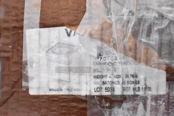 Label on scratched package showing item dimensions, color white, weight approx 25.76 lbs, lot 5934, made in Colombia.