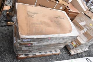 6 brand new scratch and dent Lancaster outdoor tables in packaging, with umbrella holes. Model 42TCAU3248GY, gray color.