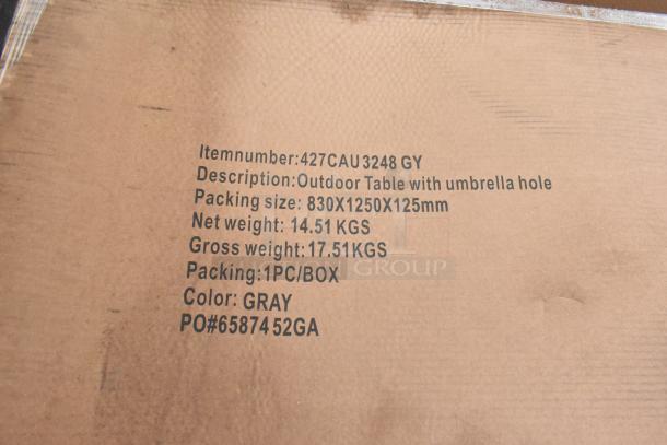 Cardboard packaging label for an outdoor table with umbrella hole. Item number: 427CAU3248 GY. Color: Gray. Packing size: 830x1250x125mm. Net weight: 14.51 kg.