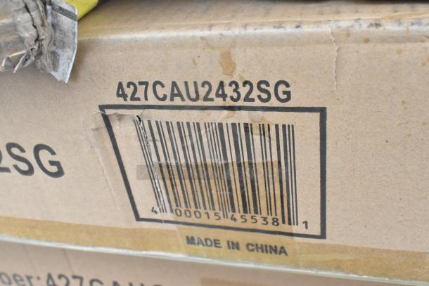 Cardboard box labeled "427CAU2432SG" with barcode, marked "Made in China." Box shows signs of minor damage.
