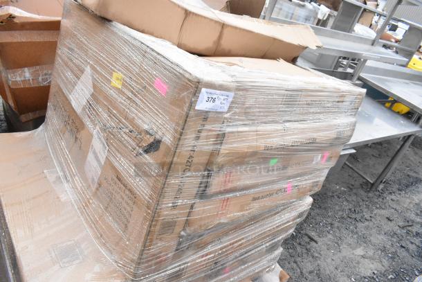 Sealed pallet of 15 scratch and dent items in original boxes, including outdoor tables. Labels show item number 376.