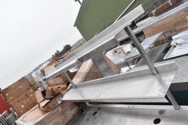 Commercial table with two-tier over shelf and drawer, stainless steel, used condition, suitable for kitchen or workspace.