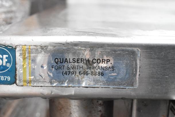 Commercial table with two-tier overshelf and drawer from QualServ Corp, Fort Smith, Arkansas. Durable, stainless steel.