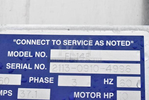 LVO FL14E stainless steel commercial washer tag showing model FL14E, serial 2113-0910-4996, 3 phase, 460 volts.