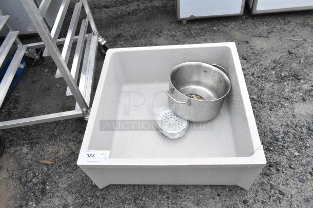 Poly mop sink in used condition with small scratches. Comes with metal bucket and drain cover. Auction tag reads "383".