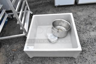 Poly mop sink in used condition with small scratches. Comes with metal bucket and drain cover. Auction tag reads "383".