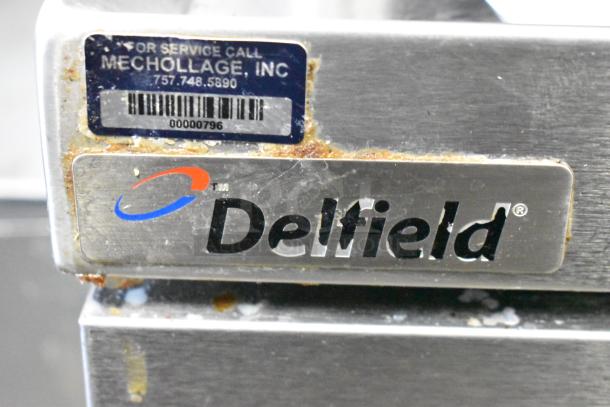 2017 Delfield F2936CP 2 Drawer Chef Base, metal body, brand logo, rust marking visible, 115V, 1 Phase, on casters.