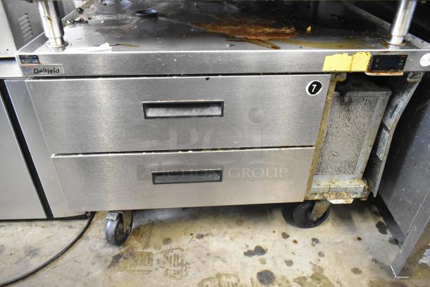 2017 Delfield F2936CP Chef Base, 2 drawers, on commercial casters, 115V, worn condition, Delfield label visible.