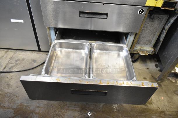 2017 Delfield F2936CP Chef Base, 2-drawer, stainless steel, on casters, 115V, used condition. Features visible wear.