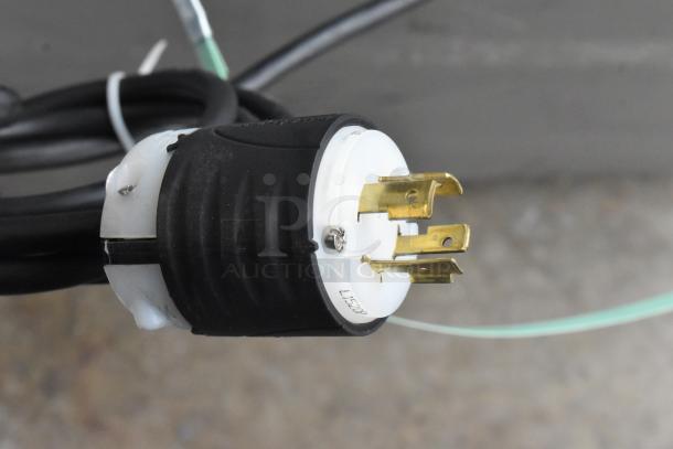 Close-up of a power plug for Pro-Cut KS-120 commercial meat saw, showing a 3-phase, 220-volt connector.