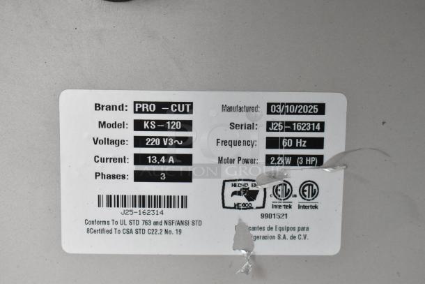 Pro-Cut KS-120 Vertical Band Meat Saw label showing model, voltage, current, phases, motor power, and manufacture date.