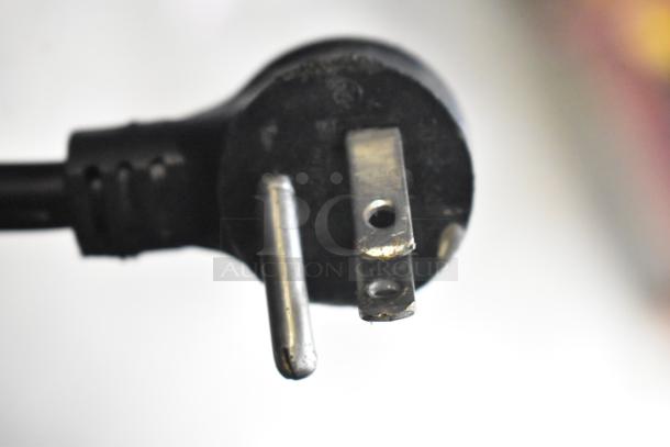 Close-up of a 115-volt, 1-phase plug from a 2017 True GDM-12-HC-LD commercial cooler. Plug shows slight wear.