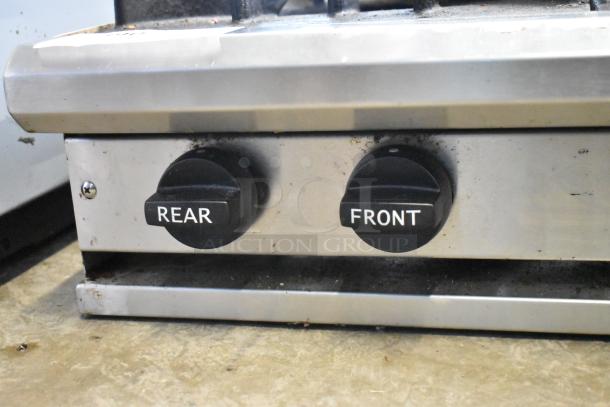 BT60-4N Commercial Countertop Gas Range, 4 burners, labeled front and rear controls, stainless steel, shows signs of use.