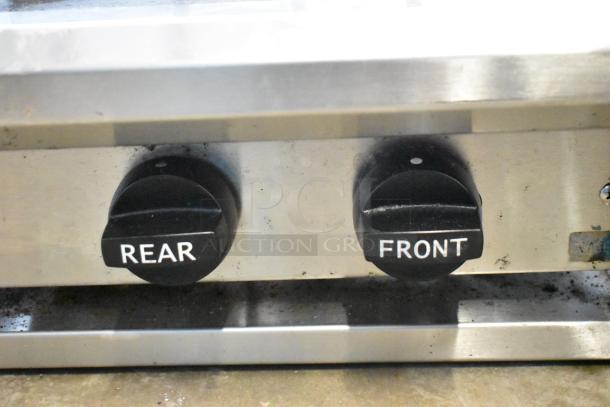 BT60-4N Gas Range controls, showing "Front" and "Rear" burner knobs, stainless steel finish, good condition.