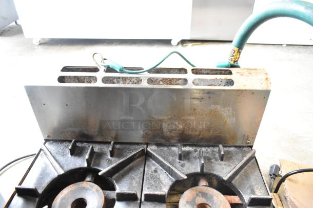 BT60-4N Commercial 4 Burner Gas Range, visible wear, rust on burners; stainless steel, countertop model.