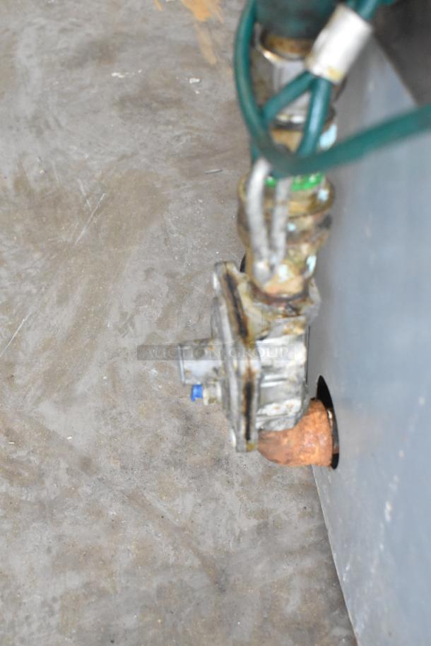 Gas connection on BT60-4N commercial countertop 4-burner gas range, showing rust and wear on fittings.