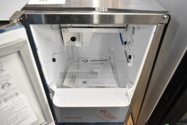 2024 Hoshizaki AM-50BAJ-DS Commercial Top Hat Cuber Icemaker, 115V, open showing interior and instruction manual.