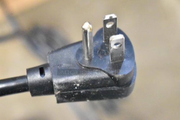 Close-up of a three-prong plug for the 2024 Hoshizaki AM-50BAJ-DS Top Hat Cuber Icemaker. 115 Volts, 1 Phase.