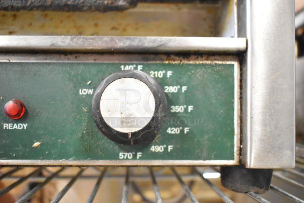 Waring WPG250 Countertop Panini Press, temperature dial and ready light. 120 Volts, 1 Phase. Visible wear on control panel.