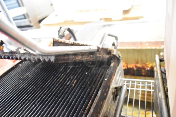 Waring WPG250 countertop panini press, 120 volts, 1 phase. Visible wear and grease on grill plates and edges.