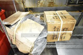 Two boxes of NSP-12 non-stick pizza pans, unopened. Each box labeled with item details and weights.