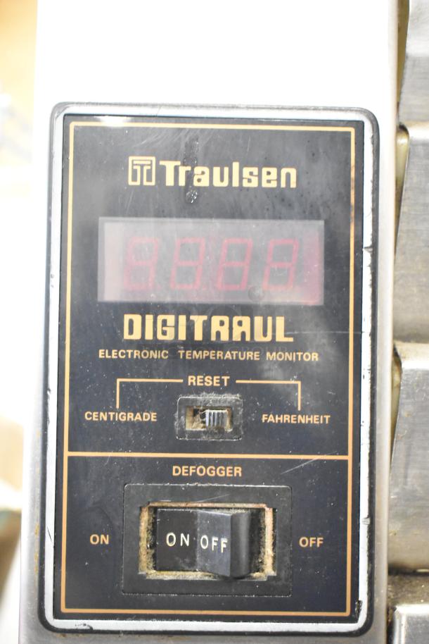 Traulsen DigiTraul electronic temperature monitor panel, features centigrade and Fahrenheit settings, with defogger switch.
