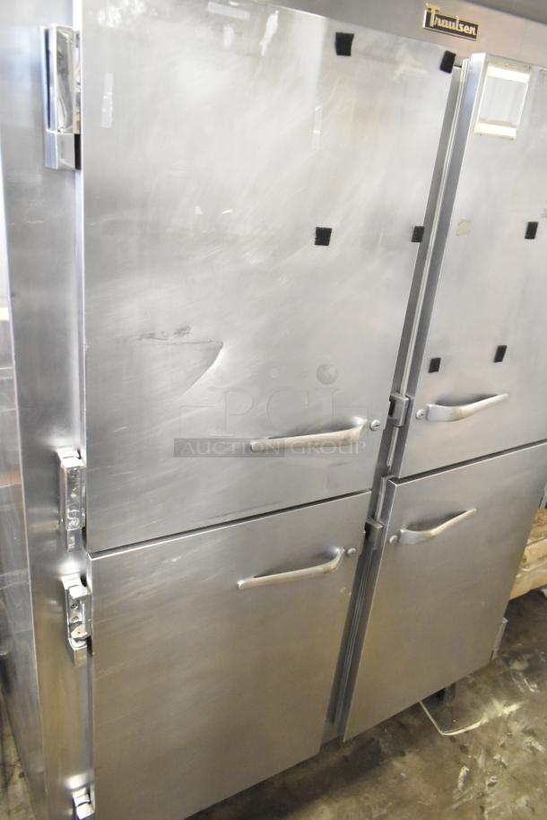 Traulsen commercial reach-in refrigerator with 4 half-size doors on casters. Stainless steel exterior, good condition.