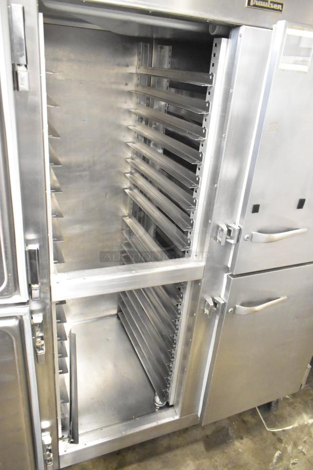 Traulsen commercial reach-in refrigerator with four half-size doors, stainless steel, on casters, interior shelving visible.