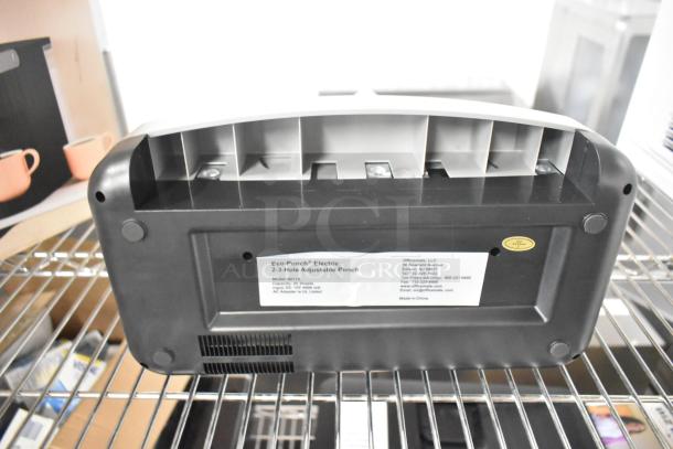 EcoPunch Electric 2-3-Hole Adjustable Punch, model 80115. Visible label shows capacity of 15 sheets. In good condition.