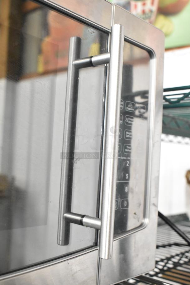 Avanti MT116V4M countertop microwave oven, stainless steel finish, digital controls, 120 volts, 1 phase, sleek handle design.