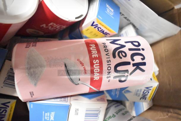 Box containing Visine Dry Eye Relief, Pick Me Up Pure Sugar, and First Aid Eye Care Treatment Pack. Items appear unopened.