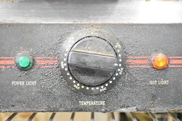Close-up of Adcraft SG-813 Panini Press control panel, showing power light, temperature dial, and hot light indicators.