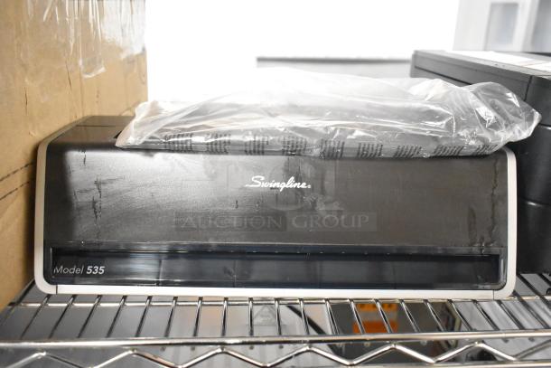 Swingline 535 Electric 3 Hole Punch, silver-platinum, handles 28 sheets, 9/32" holes, model marked, lightly used condition.