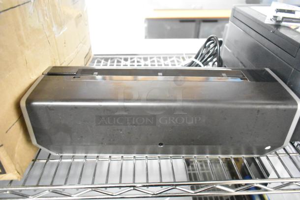 Swingline 535 electric 3-hole punch, silver-platinum, 28 sheet capacity, 9/32" holes, good condition, power cable included.