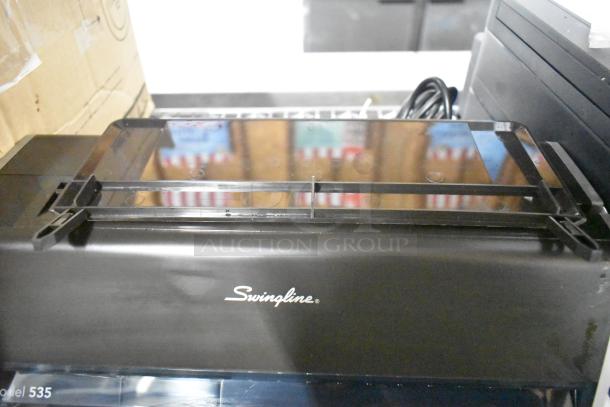 Swingline 535 electric 3-hole punch, silver-platinum, handles 28 sheets, creates 9/32" holes, in good condition.