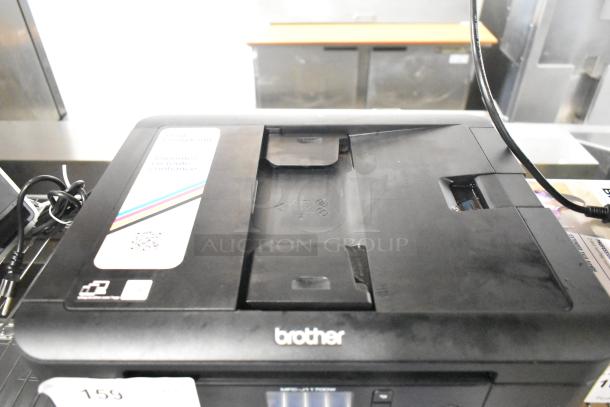 Brother MFC-J1170DW countertop copier scanner printer in good condition, label visible, compact design.