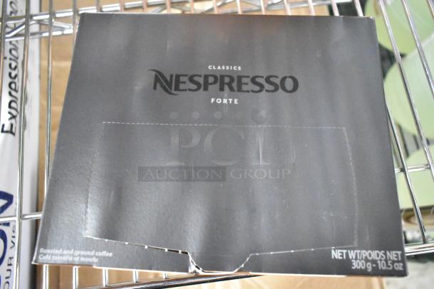 Box of Nespresso Classics Forte coffee, 300g. Visible wear on packaging. Includes 14 various beverage items.