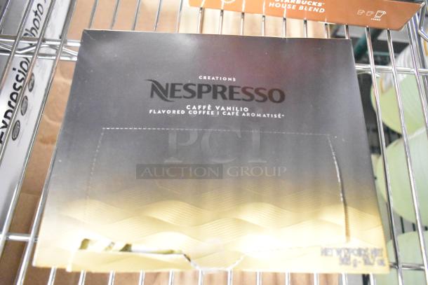 Box of Nespresso Caffè Vanilio flavored coffee on shelf; includes 14 beverage items like LavAzza mix, Starbucks roasts.