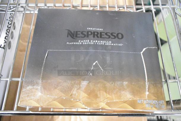 Damaged Nespresso Caffè Caramello box, 305g. Flavored coffee with visible tears on packaging.