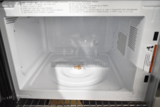 Avanti MT116V4M countertop microwave oven interior. Model: MT116V4M, 120 Volts, 1 Phase, appears in good condition.