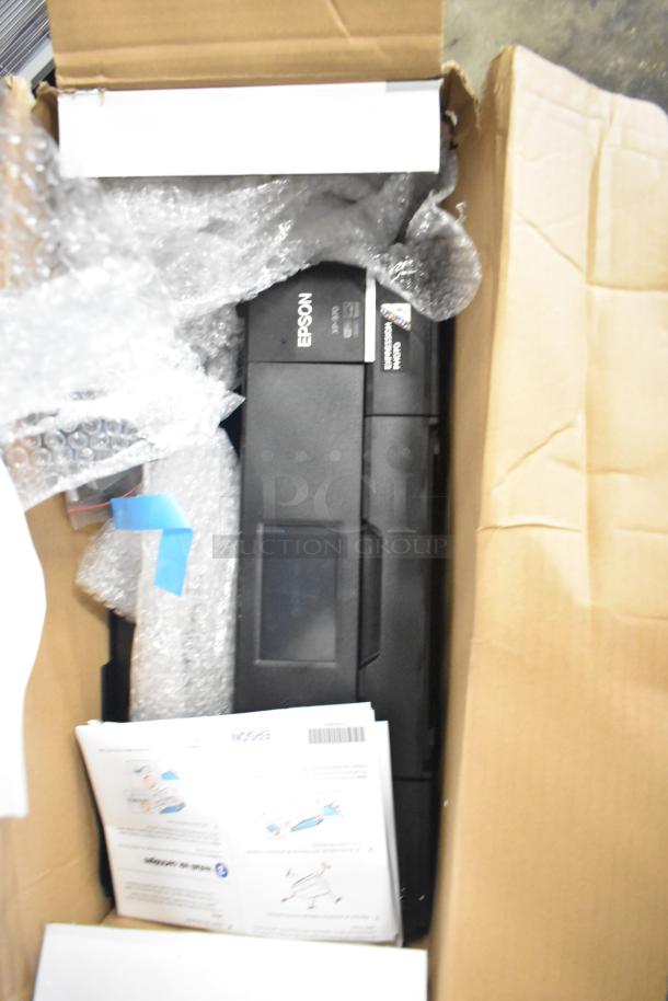 Epson Expression Photo XP-970 wide format printer in open box, packed with bubble wrap and manuals, appears unused.