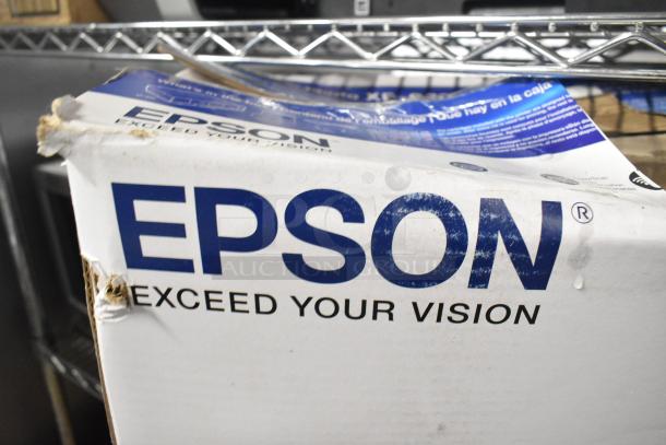 Epson Expression Photo XP-970 Wide Format Printer in original box, visible wear on packaging, ideal for photo printing.