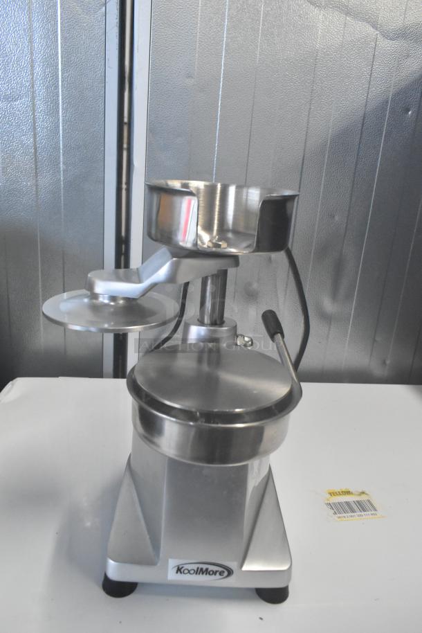 Brand new KoolMore CHM-5 hamburger patty molding press, heavy-duty, with handle. Slight scratches and dents visible.