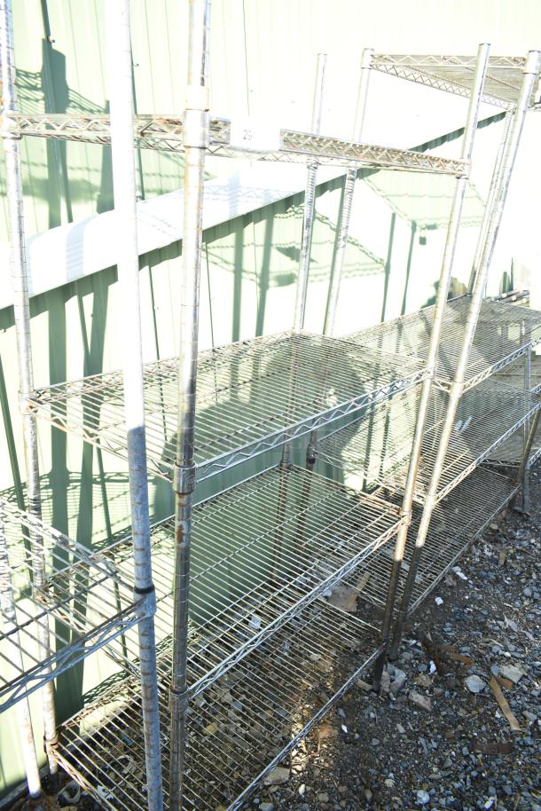 Chrome finish 4-tier wire shelving unit with visible wear. Buyer must dismantle. Consider freight charges.