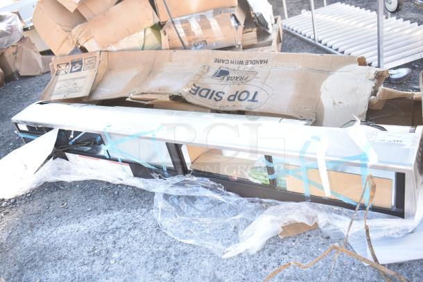 Hoshizaki HNC-210BA-R-SLH sushi display case, 83", curved glass, right side compressor, broken glass visible, in packaging.